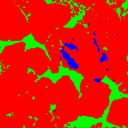 Segmented image with red particle regions, green pore regions and blue segmented inclusions