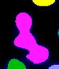 Bright magenta irregular vertical blob with small yellow arc above and green and blue blobs on black background