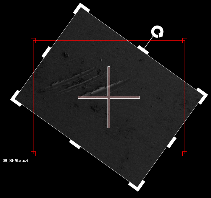 Rotated dark SEM image with central white crosshair, red selection box, white handles and label 09_SEM-a.czi