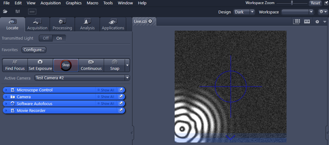Workspace with Locate panel at left and live camera view showing blue crosshair and concentric bright rings at lower left